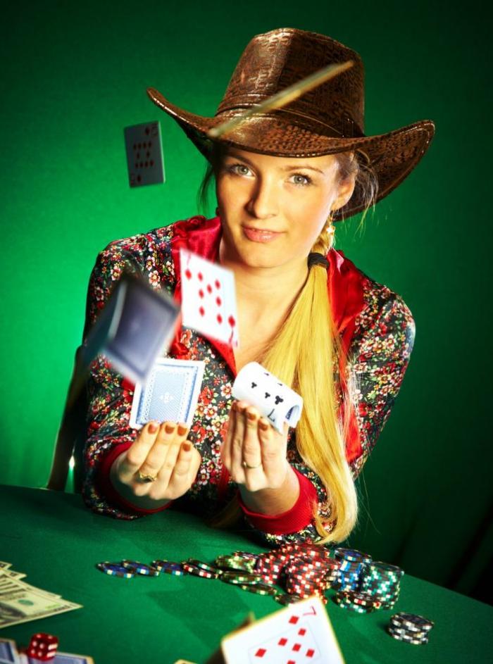 cowboy playing poker in a casino